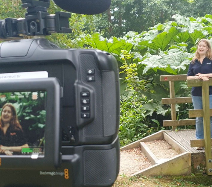 camera filming an intern for genAI video